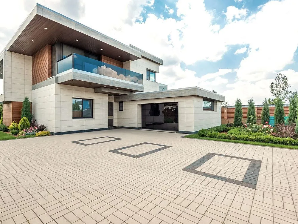 A finished outdoor concrete area beside a home