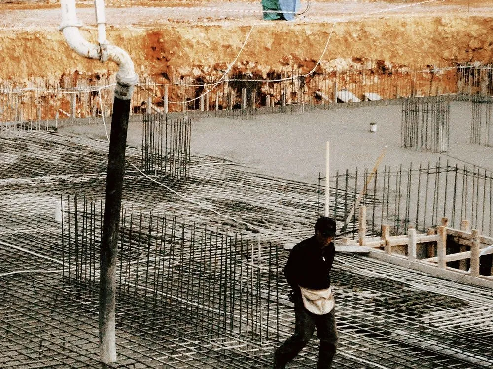 A steel-reinforced concrete slab set out and ready to pour